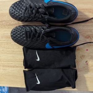 Nike soccer cleats and shin guards